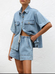 Light wash denim co-ord set with short sleeve button-up shirt and drawstring shorts.