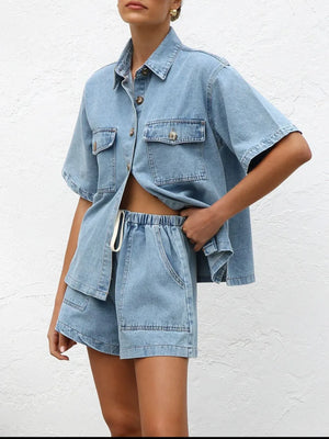 Light wash denim co-ord set with short sleeve button-up shirt and drawstring shorts.