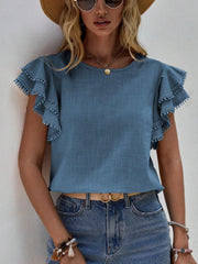 Dusty Blue ruffle sleeve blouse with pom-pom trim and round neckline.