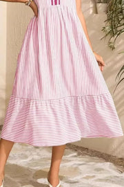 Blush pink striped midi dress with ruffle hem and sleeves.
