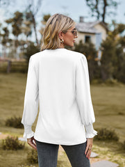 White long sleeve blouse with pleated yoke and shirred cuffs
