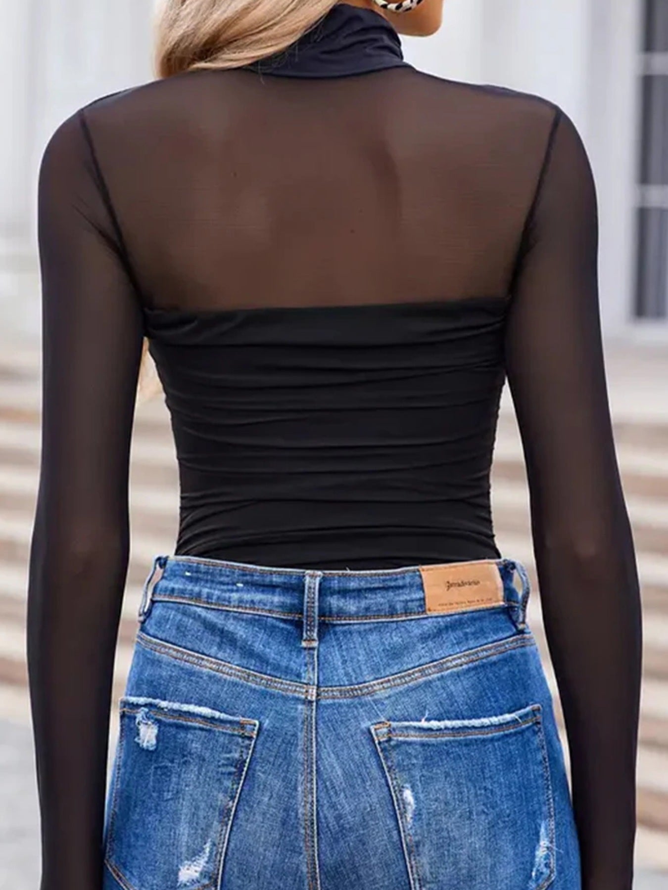 Black sheer mesh high neck maternity shirt with ruched bodice detail.