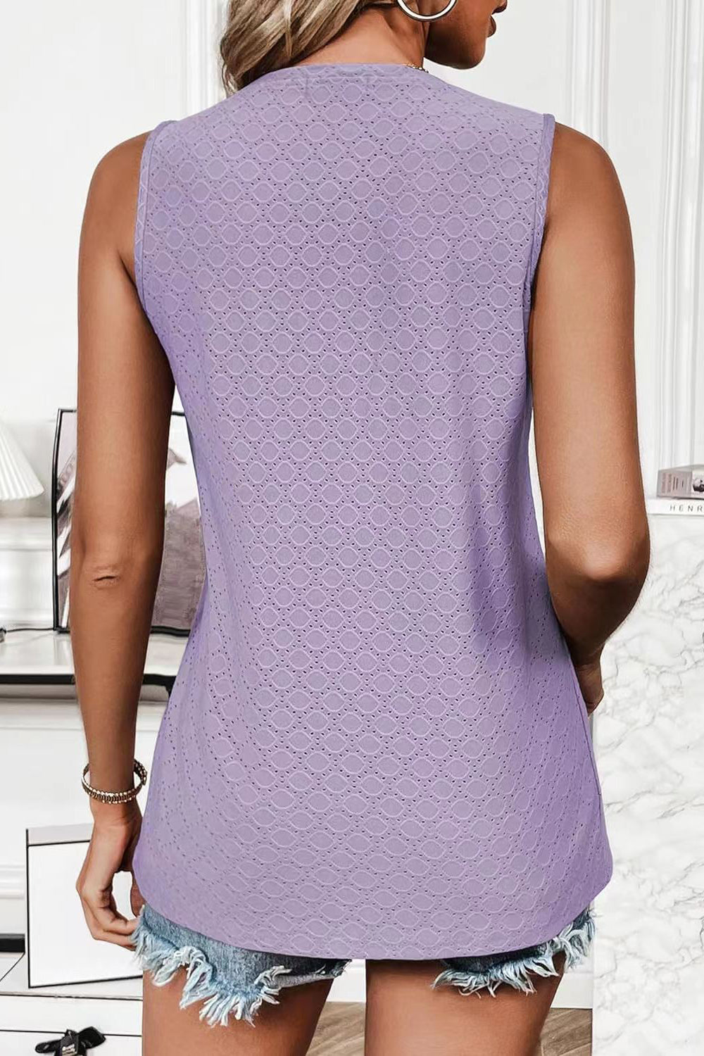 Lavender textured sleeveless shell top with allover diamond eyelet pattern.