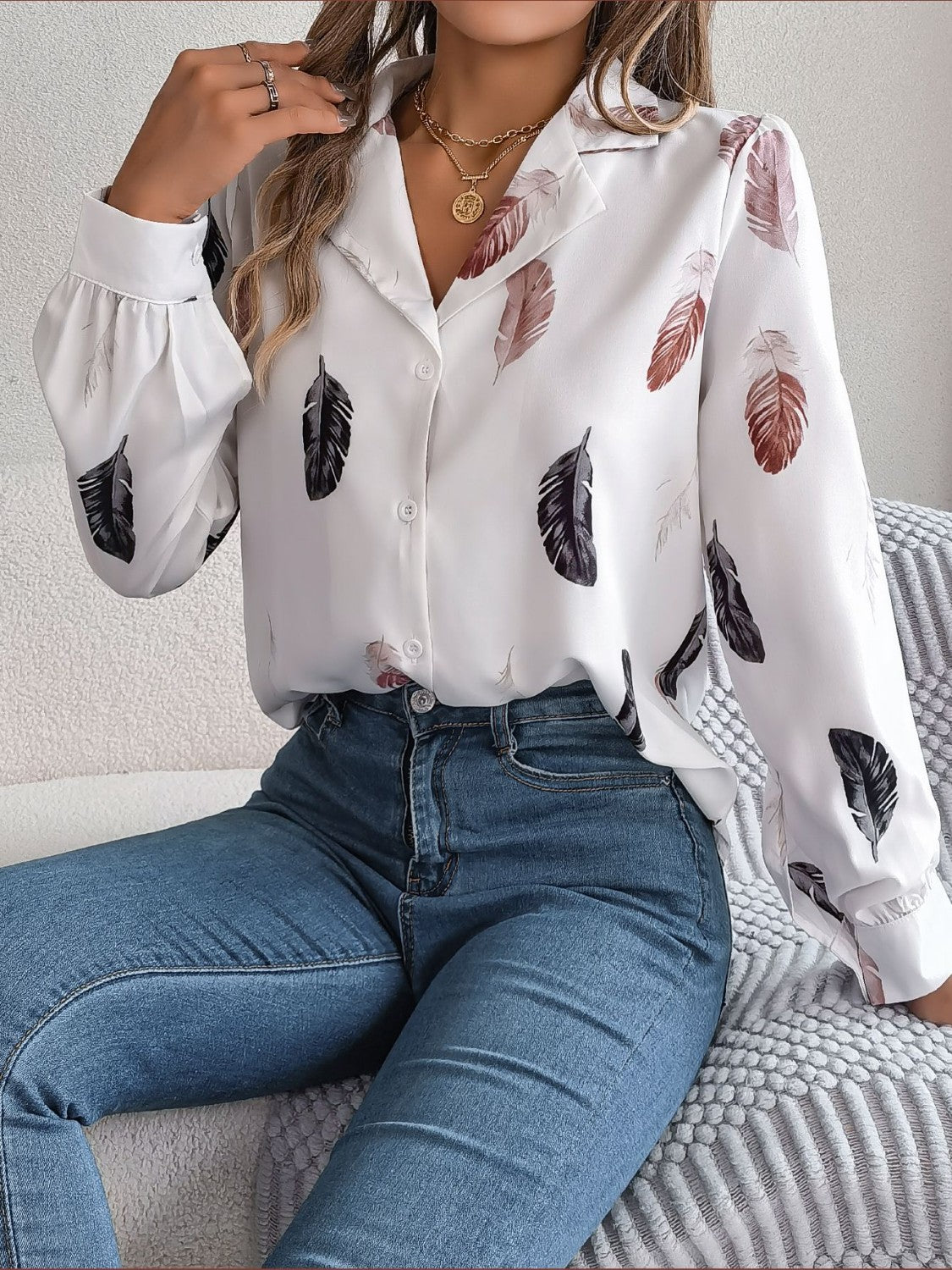 White feather print blouson sleeve button-down shirt with acrylic fabric.