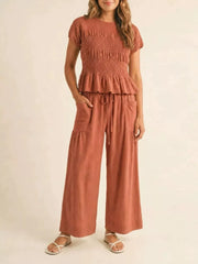 Smocked Peplum Top And Wide-leg Pants Set in Terracotta, fabric detail