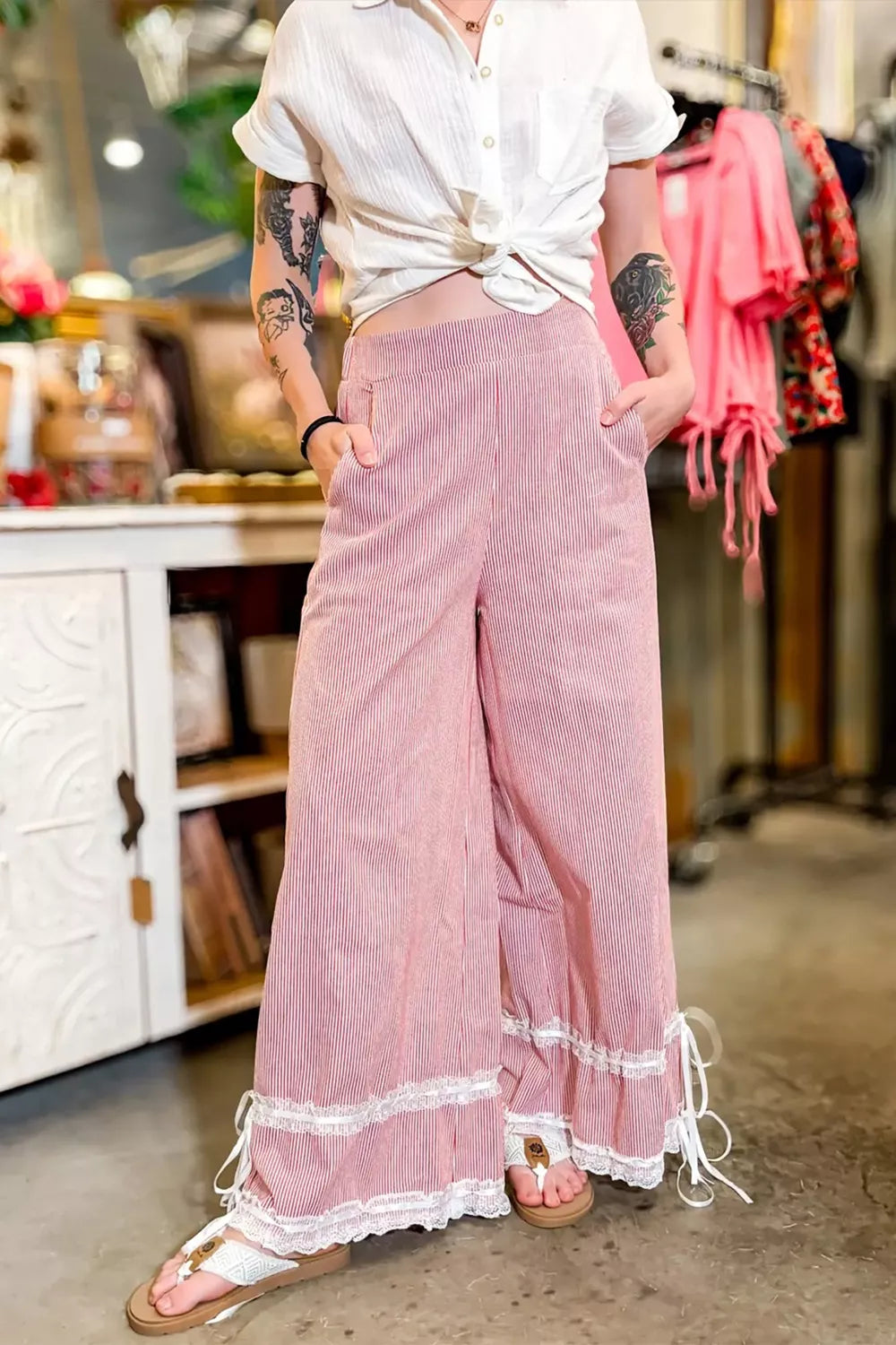 Lace-trimmed stripe wide-leg maternity pants with drawstring detail.