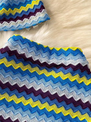 Chevron knit halter crop top and maxi skirt set in blue, yellow, and purple zigzag pattern.