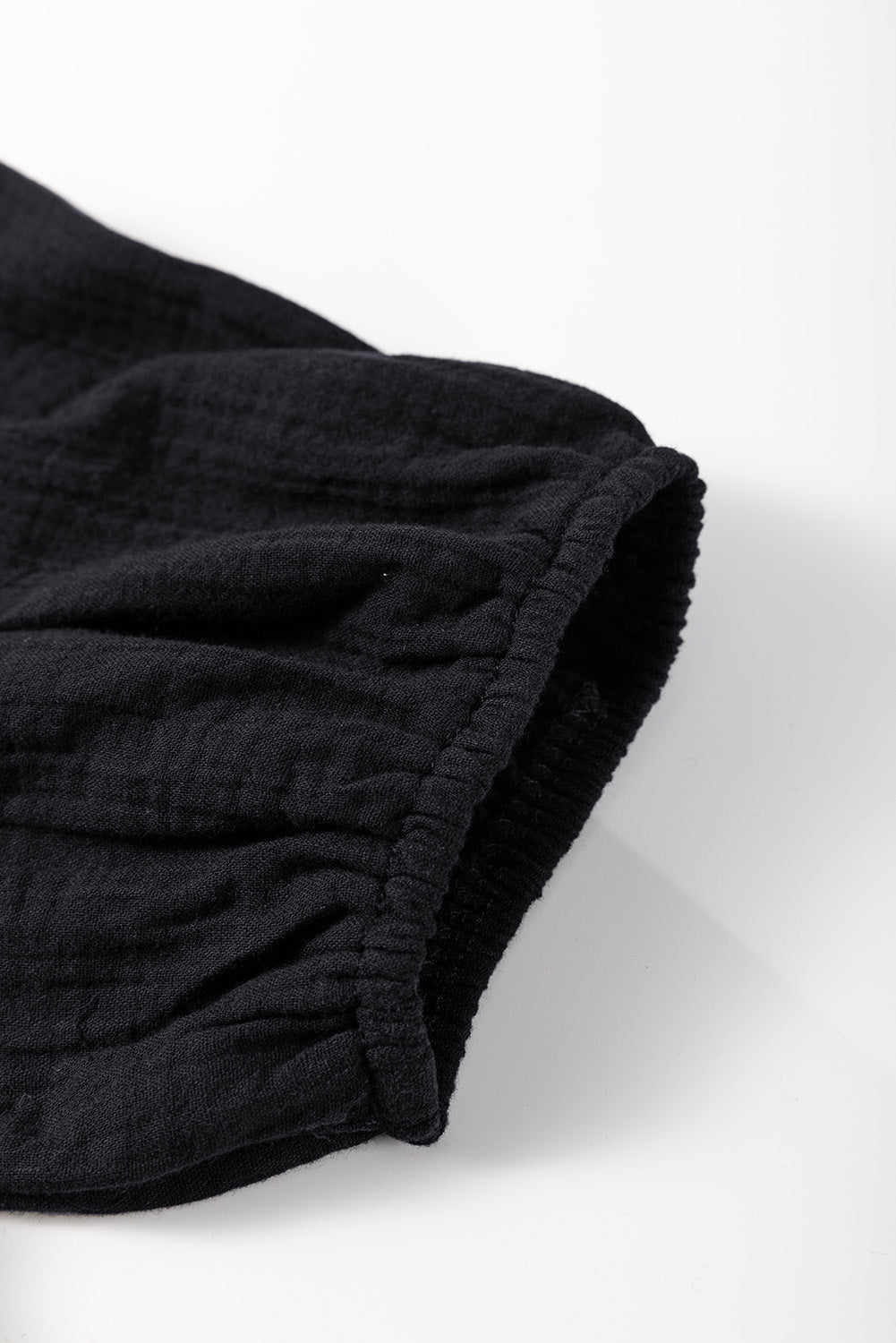 Black gauze blouse with cinched puff sleeve detail