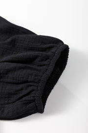 Black gauze blouse with cinched puff sleeve detail
