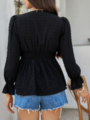 Black Swiss dot blouse with smocked waist and ruffled cuffs