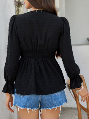 Black Swiss dot blouse with smocked waist and ruffled cuffs