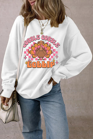 White graphic sweatshirt with retro turkey and "Gobble Gobble" text, perfect for Thanksgiving.