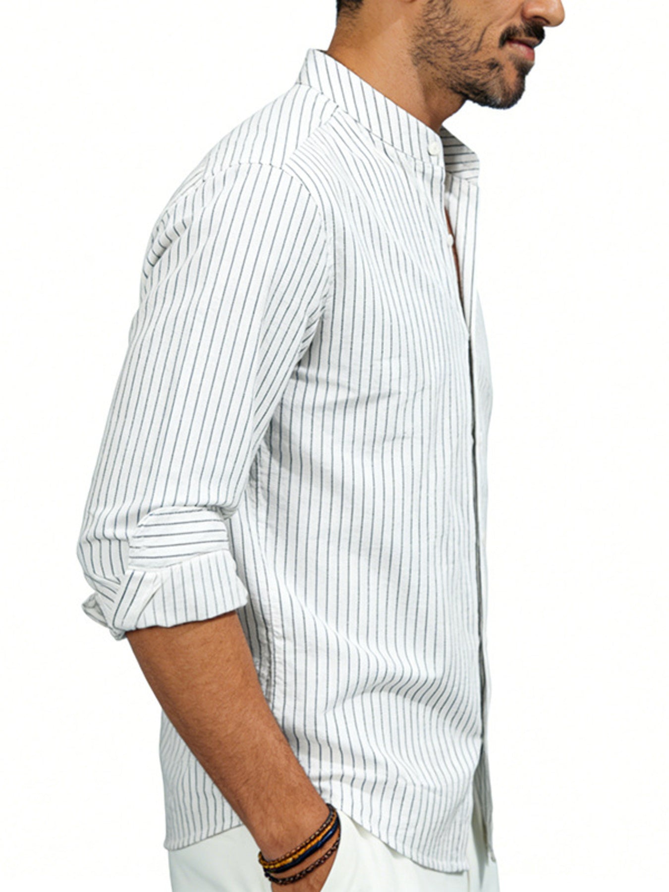 Men's white cotton blend long sleeve shirt with subtle pinstripes and buttoned collar.