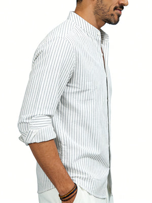 Men's white cotton blend long sleeve shirt with subtle pinstripes and buttoned collar.