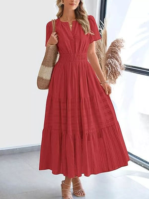Scarlet ruched V-neck tiered midi dress with smocked waist and short sleeves.