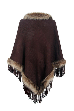 Chocolate knit poncho with faux fur trim and fringe detail.
