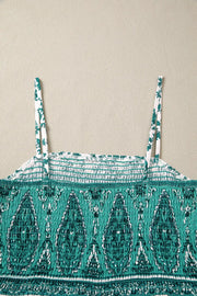 Shirred cami maxi dress with green paisley print and floral straps.