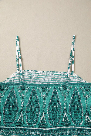 Shirred cami maxi dress with green paisley print and floral straps.