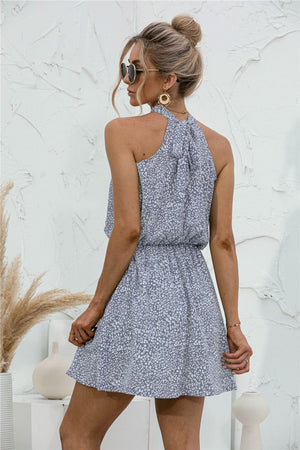 Misty blue floral halter neck mini dress with elastic waist and tie back detail.