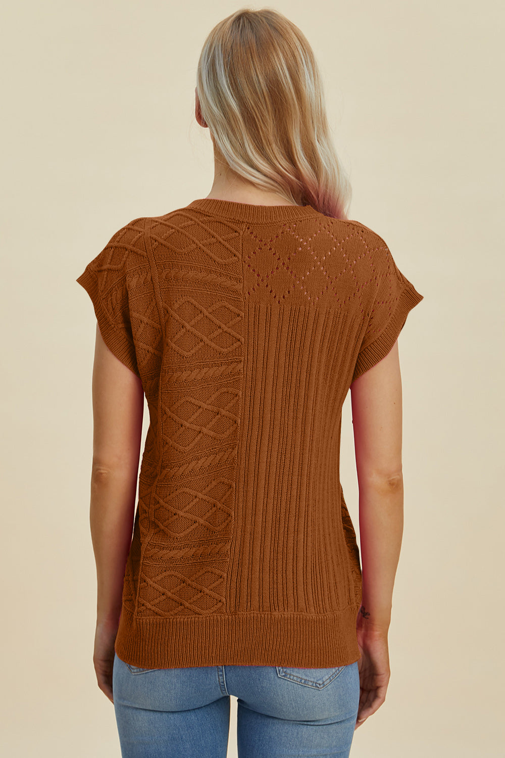 Brown knit patchwork top with cable and diamond textures, short sleeves.