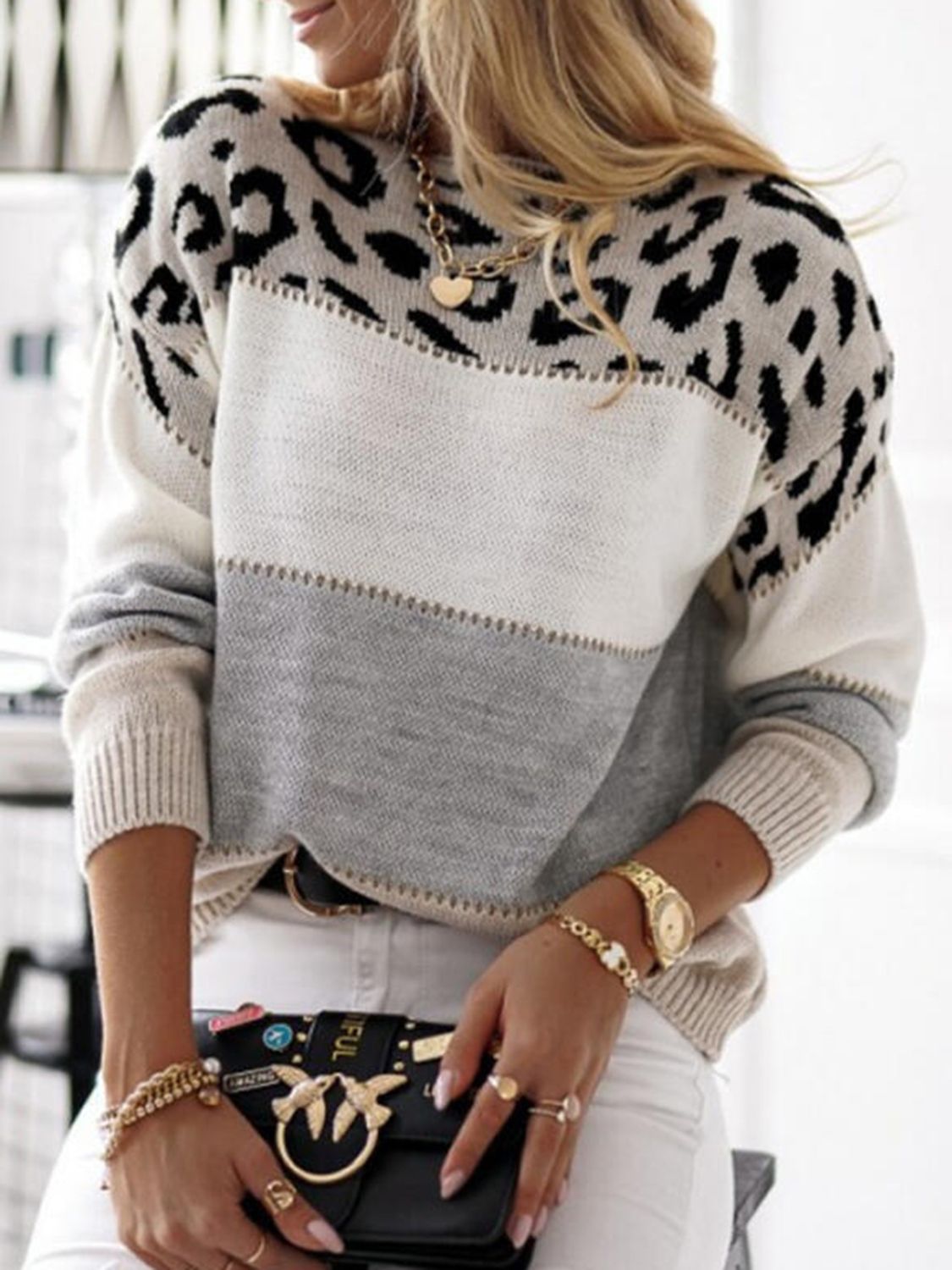 Leopard panel knit sweater with colorblock stripes in gray, white, and cream.
