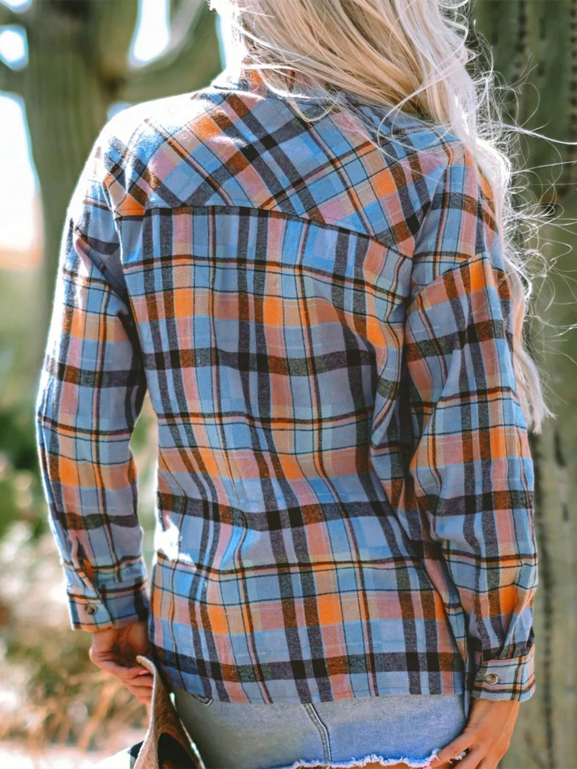 Oversized plaid shacket in sky blue, orange, and black with a relaxed fit.