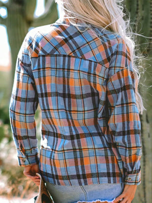 Oversized plaid shacket in sky blue, orange, and black with a relaxed fit.