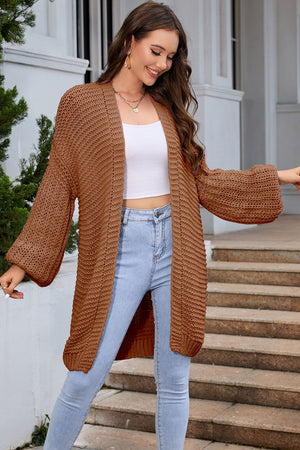 Camel textured knit cocoon cardigan with balloon sleeves and open front.