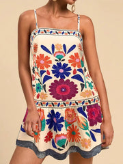 Beige mini dress with a vibrant floral print, square neckline, and spaghetti straps.