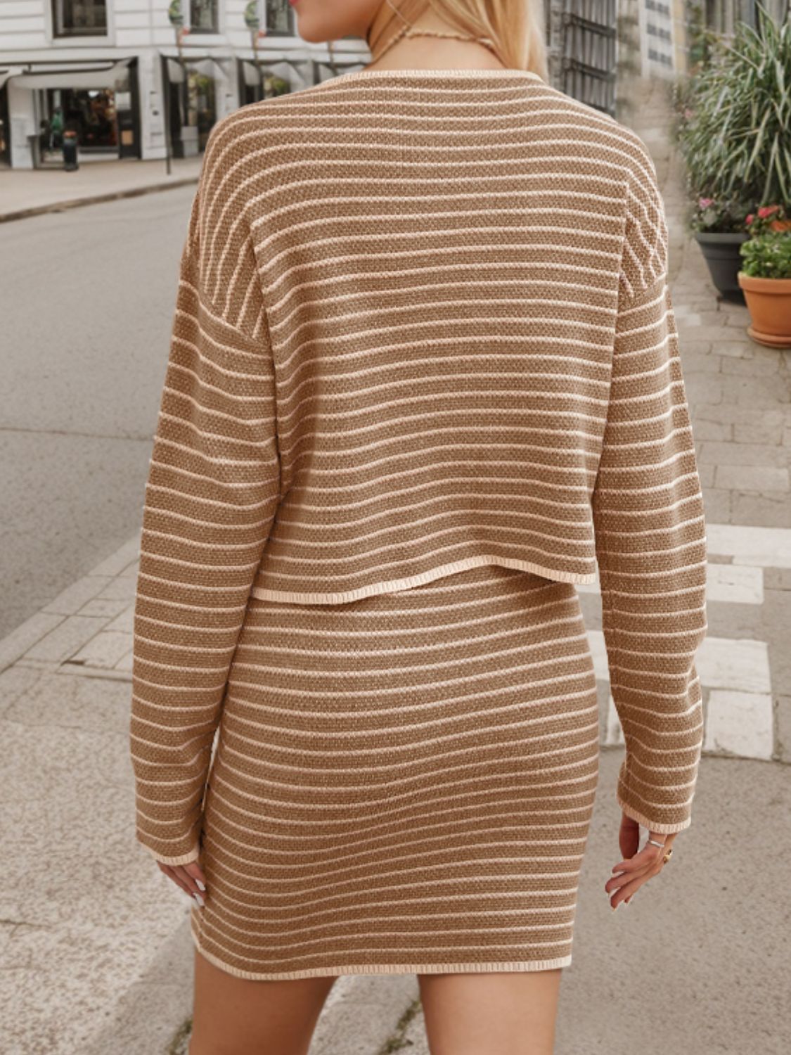 Camel knit co-ord set with horizontal stripes, crew neck sweater and mini skirt.