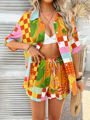 Patchwork print resort shirt and shorts set with tropical motifs and checkered patterns in vibrant colors.