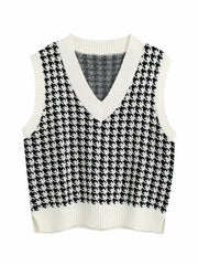 Houndstooth knit v-neck tank top in black and white with white trim.
