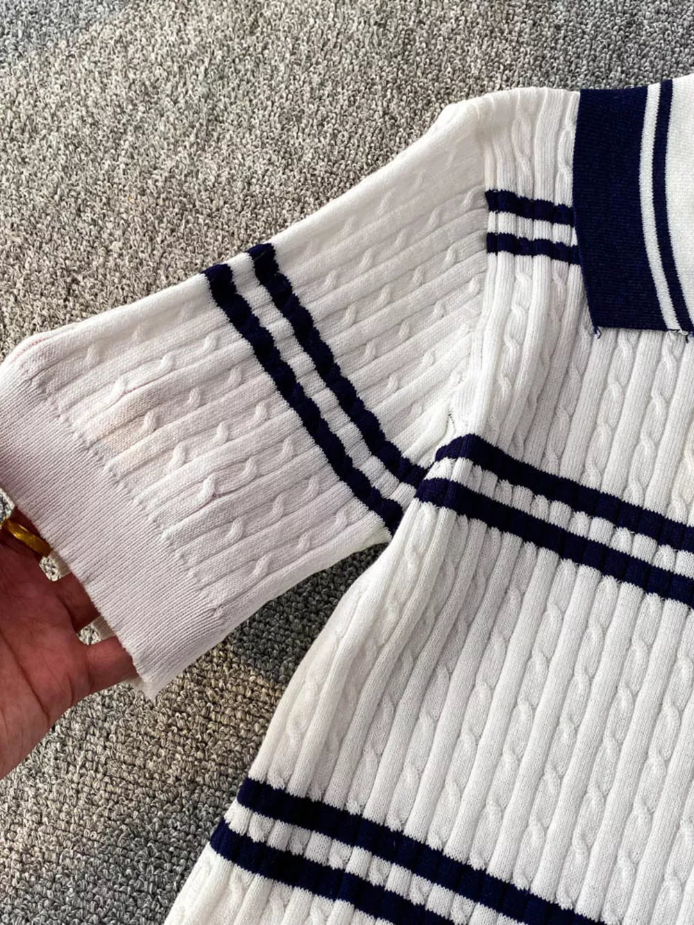 White cable knit polo t-shirt with navy stripes on collar and sleeves