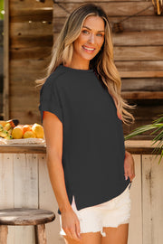 Dark gray ribbed tee with rolled sleeves and side slits, worn casually