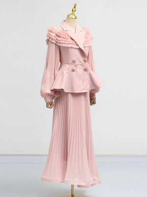 Pink skirt suit with frill collar, balloon sleeves, peplum jacket and pleated maxi skirt.