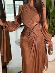 Brown twisted draped maxi dress with ruched bodice and tie sleeves.