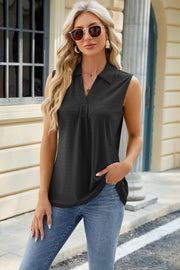 Black eyelet polo tank with pleated bib and v-neck