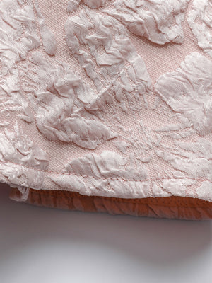 Textured floral peplum tank top in dusty pink with a boat neckline.