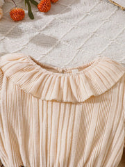 Apricot baby dress with ruffle collar and ribbed texture