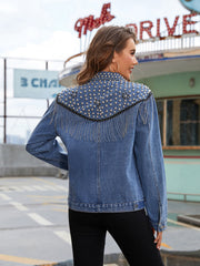 Denim trucker jacket in deep teal with studded fringe shoulder detail.