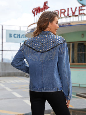 Denim trucker jacket in deep teal with studded fringe shoulder detail.