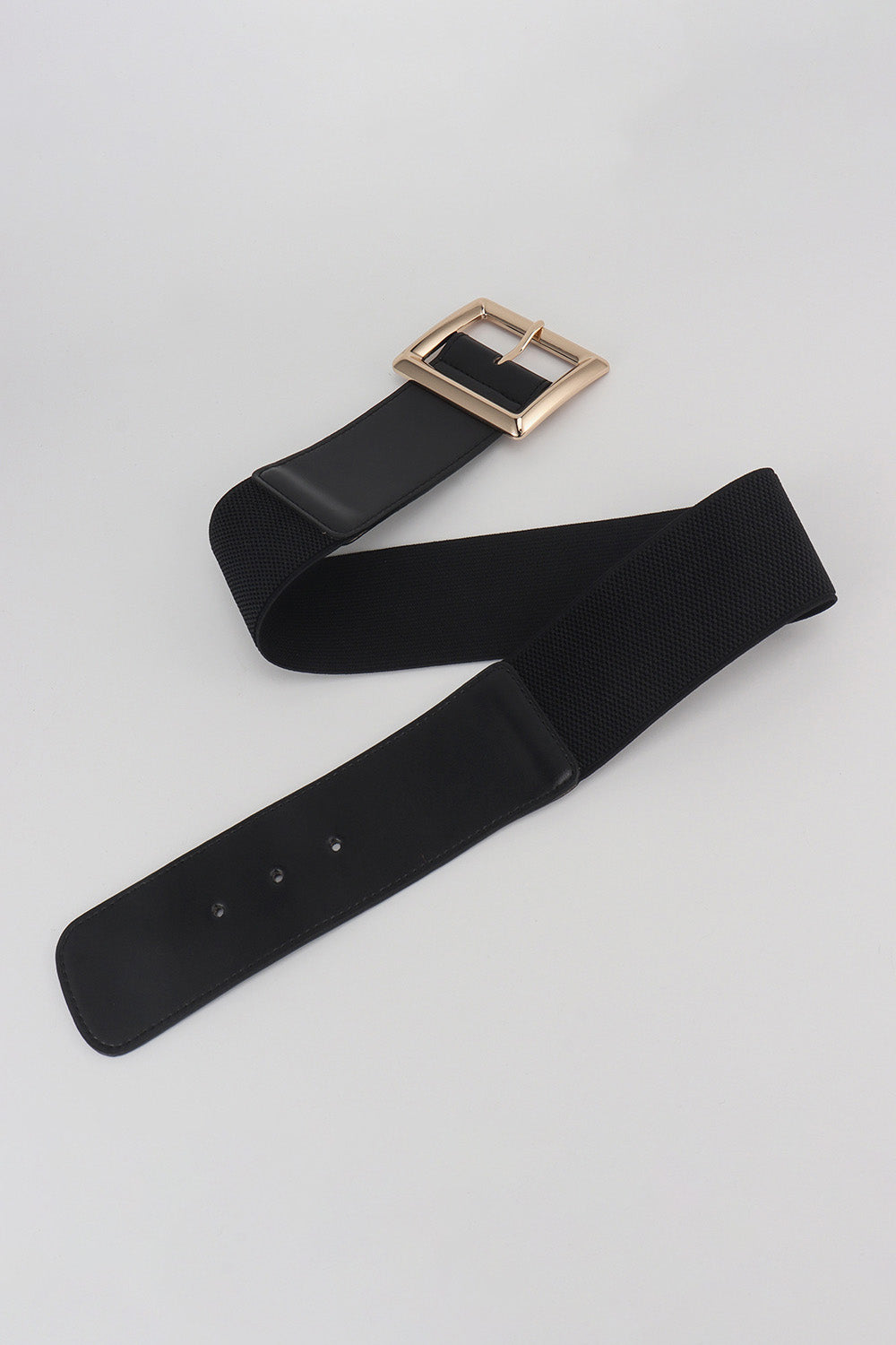 Black elastic belt with gold sculptural buckle and faux leather trim