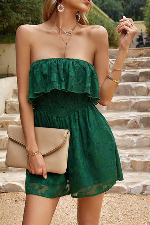 Dark green strapless romper with ruffle detail and floral embroidery.