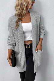 Light gray waffle knit longline cardigan with pockets and ribbed cuffs.