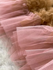 Tiered ruffle tulle skirt in pink and tan with delicate mesh texture.