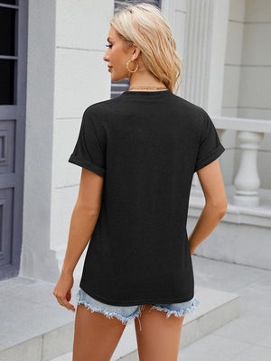 Black button-down henley shirt with rolled cuff sleeves and a relaxed fit.