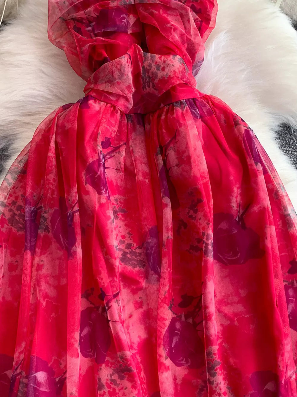Pink floral mesh maxi dress with layered detail and ruffled neckline.