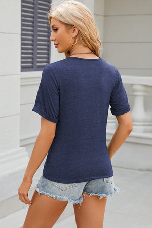 Dark blue heathered t-shirt with cuffed short sleeves and a crew neck.
