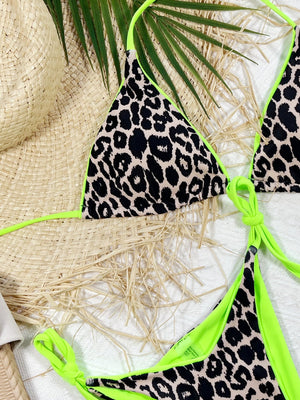 Leopard print tie-side bikini set with neon green trim and ties.