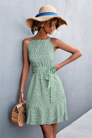 Dotted halter neck mini dress in Gum Leaf green with ruffle hem and tie waist.